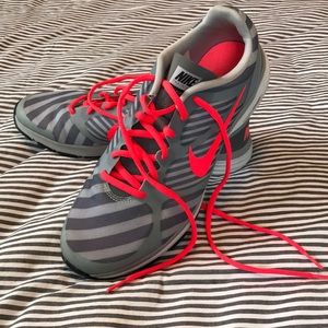 Gray and pink nike tennis shoes